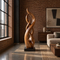 Twisting flame shaped sculpture with braided open loops on a square block base in an industrial loft living room with exposed brick
