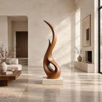Tall twisting flame shaped wood sculpture with an open loop near the base in a bright open plan living room