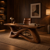 Desk with a smooth top on a twisting ribbon base with an open loop in an evening home office with walnut wall paneling