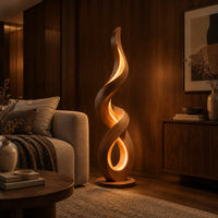 Twisting ribbon floor lamp with warm glow inside its loops in an evening living room with walnut wall paneling