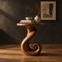 Round side table on a ribbon pedestal that ends in a spiral curl, three-quarter view showing the grain