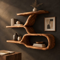 Corner detail of wall shelf with a twisting trunk and an open oval loop below beside wood, brass and linen samples