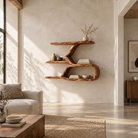 Wall shelf with a twisting trunk and an open oval loop below in a bright open plan living room