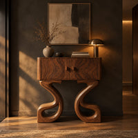 Two door console cabinet on large looping ribbon shaped legs in a dark entryway at golden hour