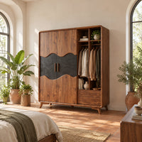 Wardrobe with two doors, a dark wavy panel and an open shelf bay in a bright bedroom with arched windows and plants