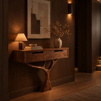 Console table with a two drawer box on a single branching tree pedestal in an evening entryway with walnut wall paneling