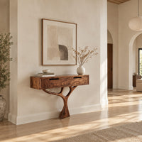 Console table with a two drawer box on a single branching tree pedestal in a bright open plan entryway