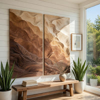 Two panel canyon wall art with graded wood layers in a bright sunroom with green plants