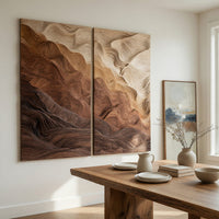 Two panel canyon wall art with graded wood layers beside a dining table in natural light