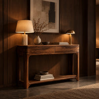 Console table with a two panel front rail and a low open shelf in an evening entryway with walnut wall paneling