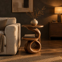 Two tier end table with a spiral ribbon base and a loop foot in a dark living room at golden hour