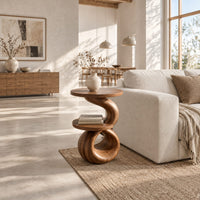 Two tier end table with a spiral ribbon base and a loop foot in a bright open plan living room