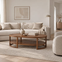 Two tier oval wooden coffee table with slim legs and half ring supports in a Scandinavian living room with white walls