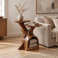 Two tier side table with a trunk base and a hollow for books in a Scandinavian living room with white walls