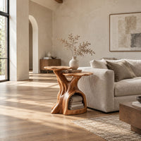 Two tier side table with a trunk base and a hollow for books in a bright open plan living room