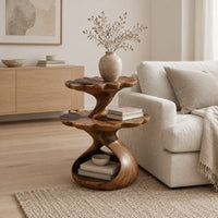 Two tier side table with scalloped tops and a twisting stem in a Scandinavian living room with white walls