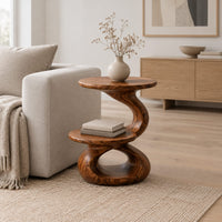 Two tier side table with a twisted stem and a figure eight base in a Scandinavian living room with white walls