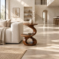 Two tier side table with a twisted stem and a figure eight base in a bright open plan living room