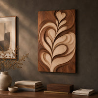 Detail of wall art panel with a carved leaf relief in light and dark tones beside wood, brass and linen samples