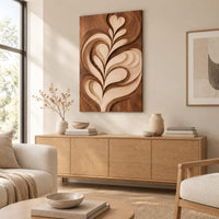 Wall art panel with a carved leaf relief in light and dark tones above a light oak sideboard in daylight