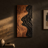 Tall wall art panel split between natural wood grain and black carved ripples on a dark charcoal plaster wall