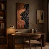 Tall wall art panel split between natural wood grain and black carved ripples above a desk in a dark study corner