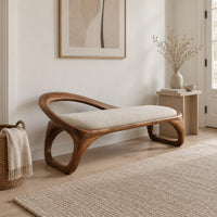 Bench with a padded seat and an arched back rail on open loop legs in a Scandinavian entryway with white walls