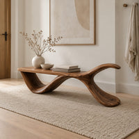 Bench with a flat plank seat, a swooping base and an upswept tail in a Scandinavian entryway with white walls