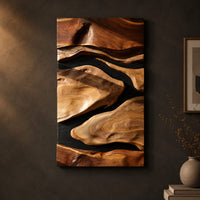 Vertical carved wall art with flowing forms on a dark ground on a dark charcoal plaster wall