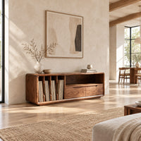 Low tv stand with vertical slots, an open shelf and two drawers in a bright open plan living room
