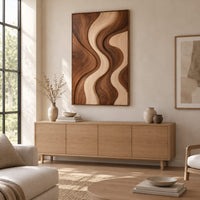 Wall art panel with flowing wave bands in dark and pale wood above a light oak sideboard in daylight