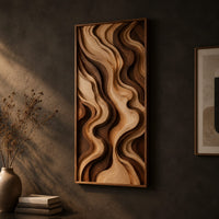 Tall framed wall art with layered wave relief in light and dark wood on a dark charcoal plaster wall