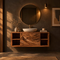 Wall mounted bathroom vanity with carved mountain ridge fronts and open cubbies in a dark bathroom at golden hour