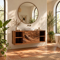 Wall mounted bathroom vanity with carved mountain ridge fronts and open cubbies in a bright bathroom with arched windows and plants