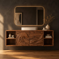 Wall mounted bathroom vanity with carved wave panels and open end shelves in a dark studio against a charcoal plaster wall