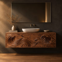 Wall mounted bathroom vanity with rolling wave carving in a dark studio against a charcoal plaster wall