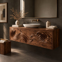 Corner detail of wall mounted bathroom vanity with rolling wave carving beside wood, brass and linen samples