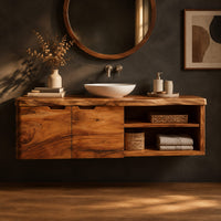 Wall mounted bathroom vanity with a live edge top and an open shelf in a dark studio against a charcoal plaster wall