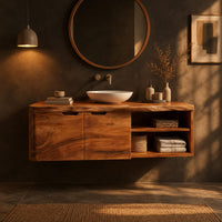 Wall mounted bathroom vanity with a live edge top and an open shelf in a dark bathroom at golden hour