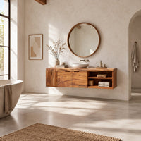 Wall mounted bathroom vanity with a live edge top and an open shelf in a bright open plan bathroom