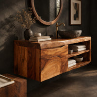 Corner detail of wall mounted bathroom vanity cabinet with a swirling grain front and open shelves beside wood, brass and linen samples