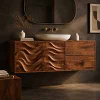 Corner detail of wall mounted bathroom vanity with wave carved doors beside wood, brass and linen samples