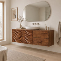 Wall mounted bathroom vanity with wave carved doors in a Scandinavian bathroom with white walls