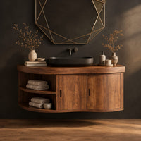 Wall mounted bathroom vanity with a wavy front, two doors and open shelves in a dark studio against a charcoal plaster wall