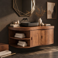 Corner detail of wall mounted bathroom vanity with a wavy front, two doors and open shelves beside wood, brass and linen samples
