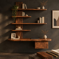 Corner detail of wall mounted wooden desk with staggered shelves above a wide work top beside wood, brass and linen samples