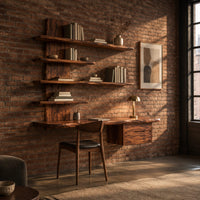 Wall mounted wooden desk with staggered shelves above a wide work top in an industrial loft home office with exposed brick