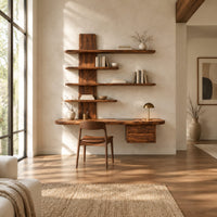 Wall mounted wooden desk with staggered shelves above a wide work top in a bright open plan home office