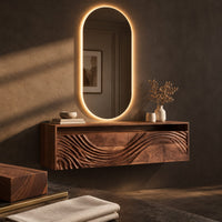 Corner detail of floating makeup vanity with an open top niche and a wave carved front beside wood, brass and linen samples