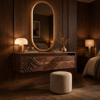 Floating makeup vanity with an open top niche and a wave carved front in an evening bedroom with walnut wall paneling
